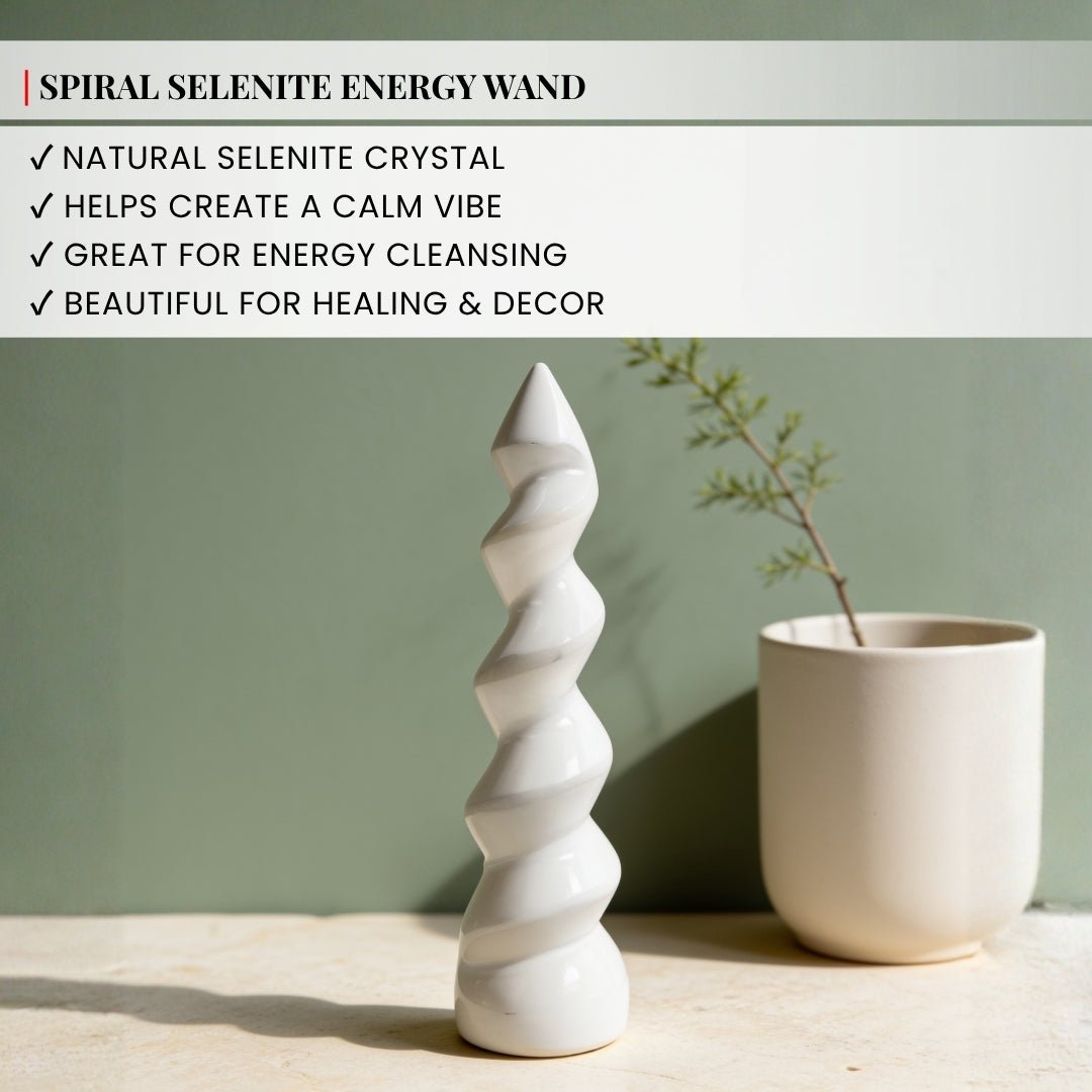 selenite unicorn horn wand held in hand for size reference