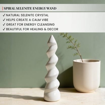 selenite unicorn horn wand held in hand for size reference