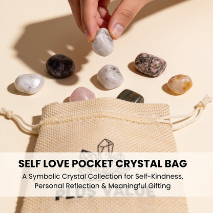 Set of polished self-love healing crystals resting in open palm demonstrating tactile size and smooth glassy finish