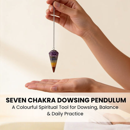 seven chakra dowsing pendulum held by its chain for scale