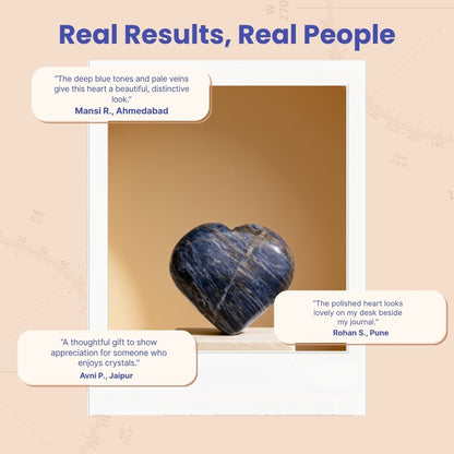Sodalite heart stone presented on rustic wooden display tray beside soft drawstring pouch and gift box