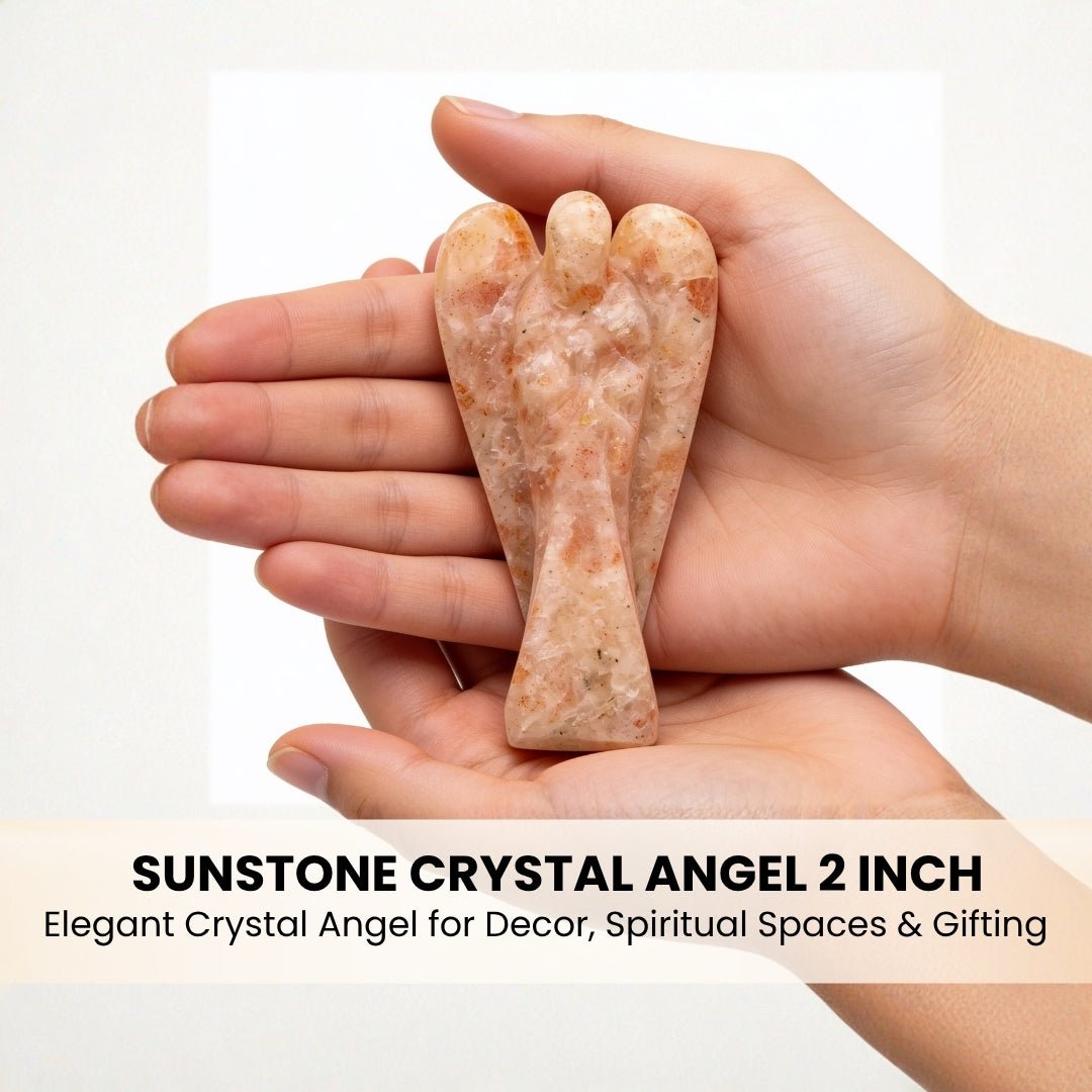 sunstone crystal angel shown in hand for scale