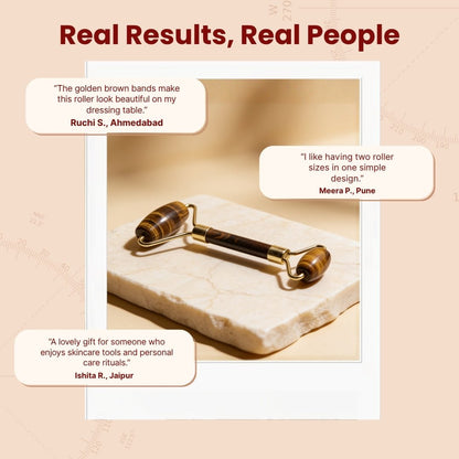 Tiger Eye facial roller presented on marble vanity tray beside serum bottle and protective gift storage box