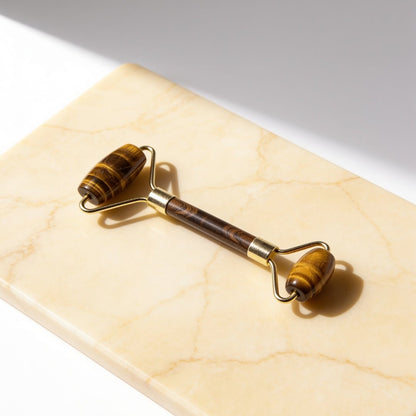 Natural Tiger Eye face, eyes, and neck roller massager with gold-tone hardware