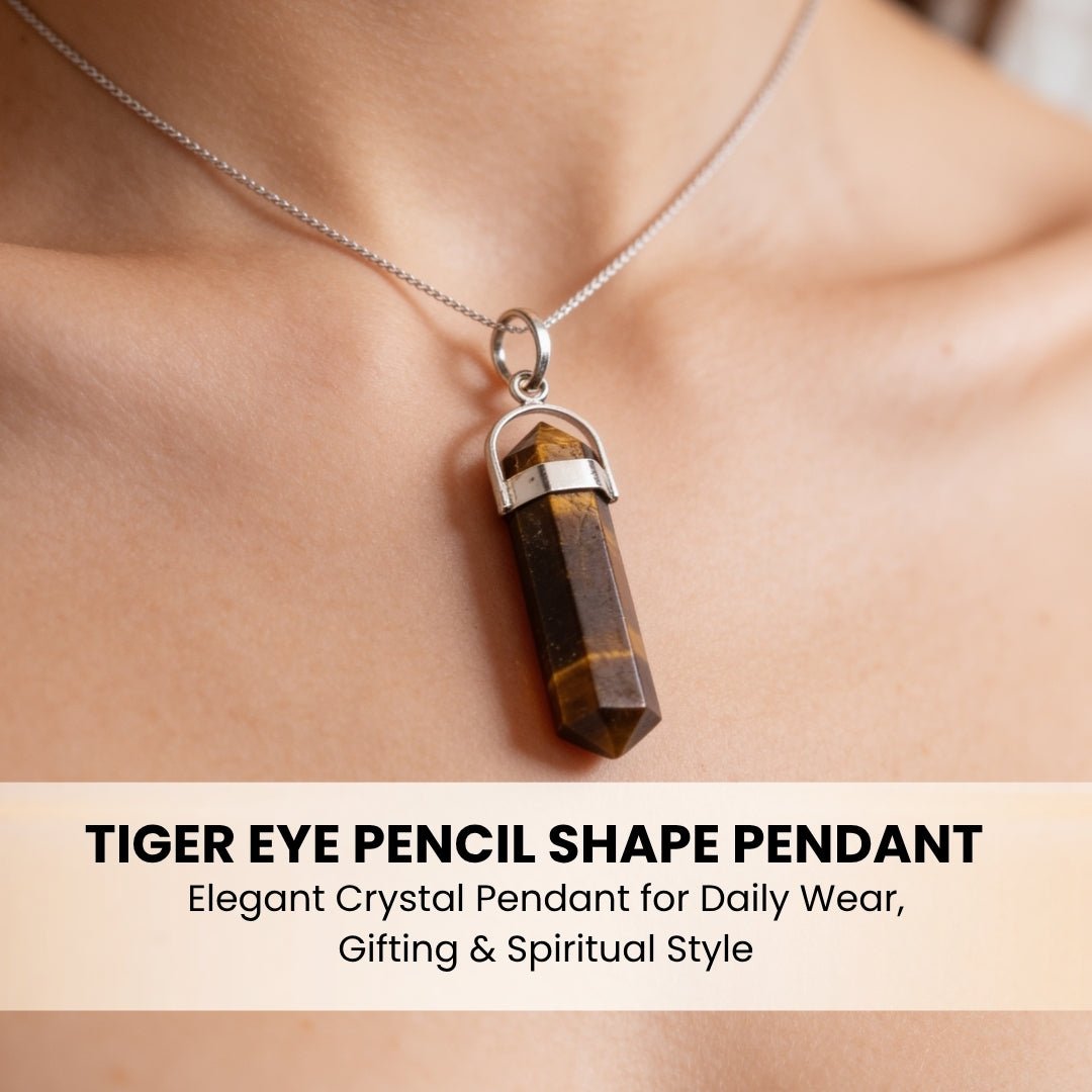 tiger eye pencil pendant held in hand for scale