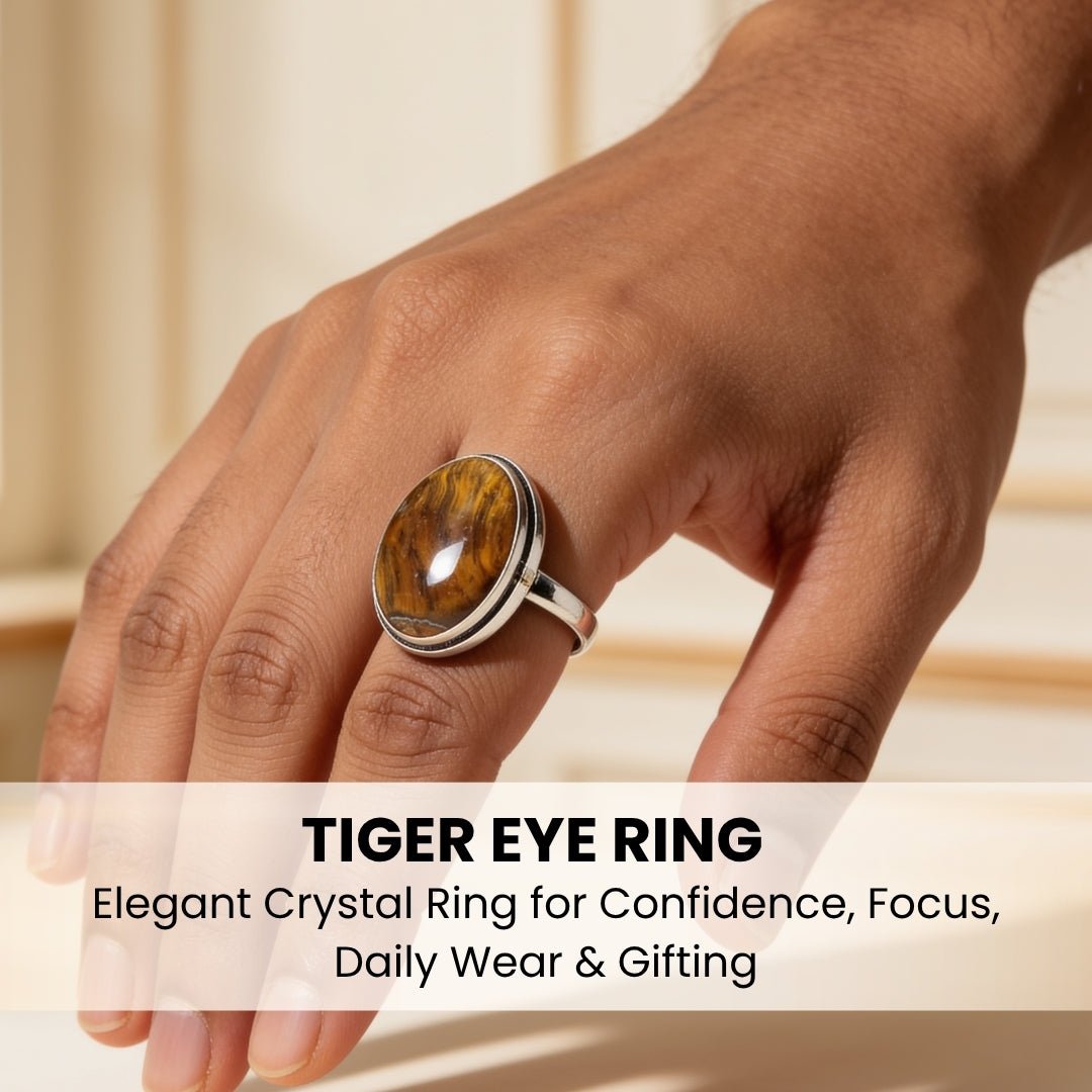 tiger eye crystal ring worn on a finger for scale