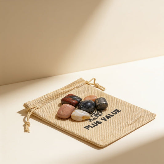 Travelling crystal protection bag featuring curated gemstones including Aquamarine, Amethyst, Black Tourmaline, Malachite, and Moonstone