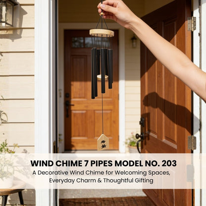 Model 203 7-pipe wind chime suspended by hand illustrating balanced circular arrangement and proportional tube scale