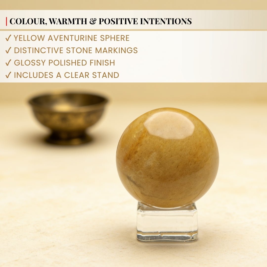 Sturdy polished clear crystal ring stand holding the round Yellow Aventurine gemstone securely upright