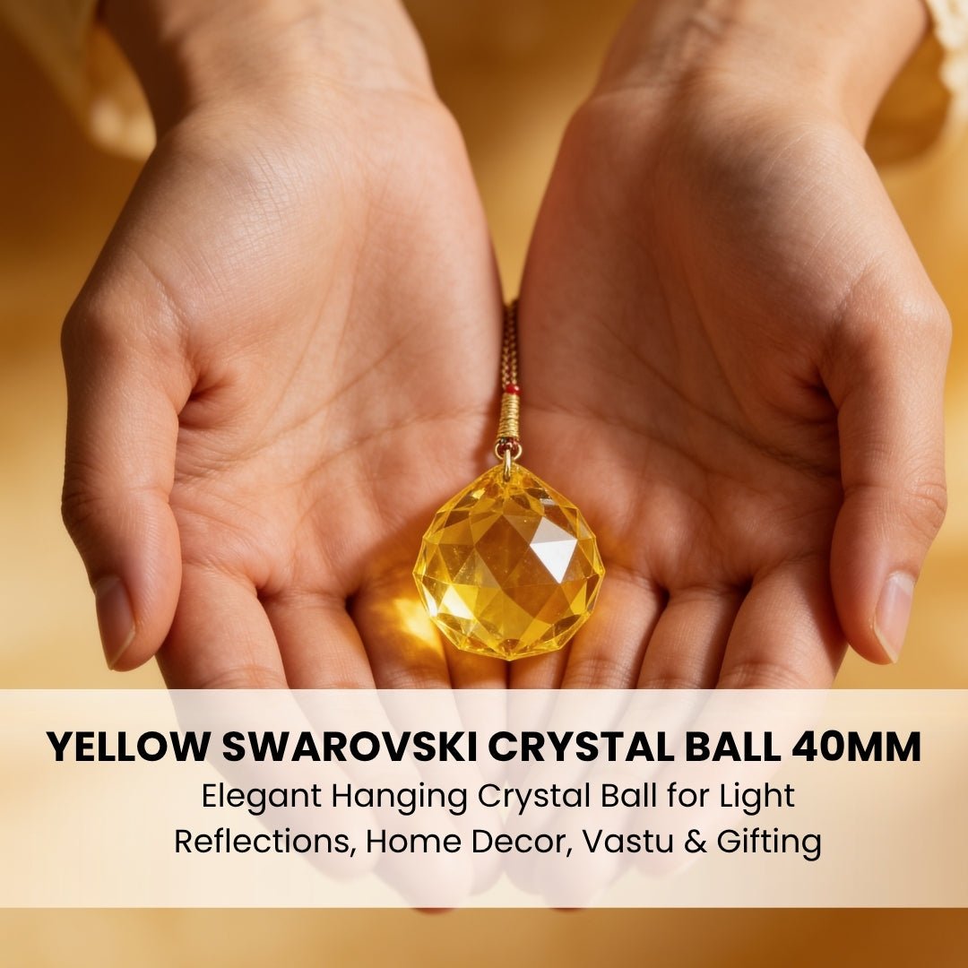 yellow 40 mm crystal ball held in hand for scale