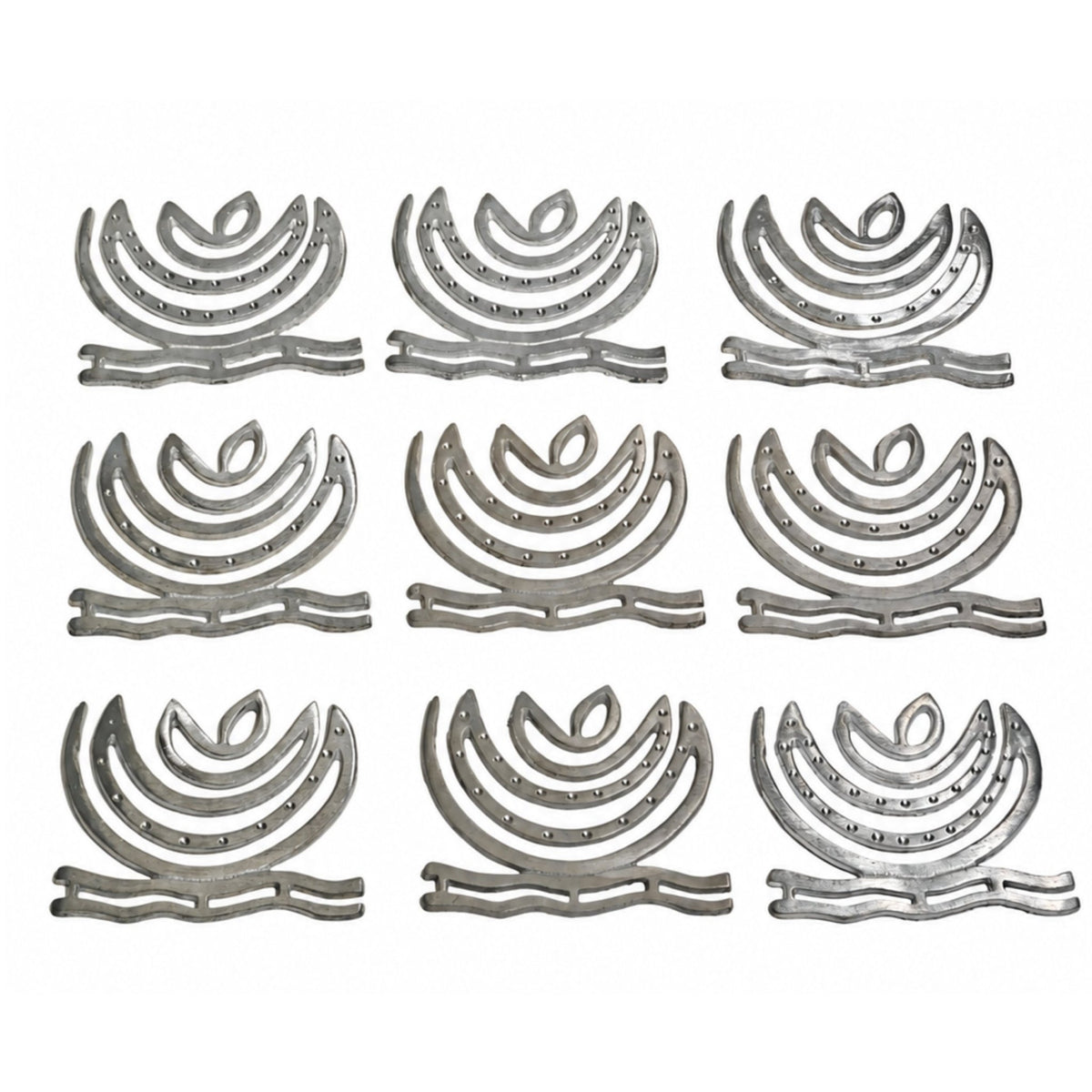 Detailed macro shot of cast zinc metal surface showing authentic bright silver finish, smooth spiral curves, and clean edges